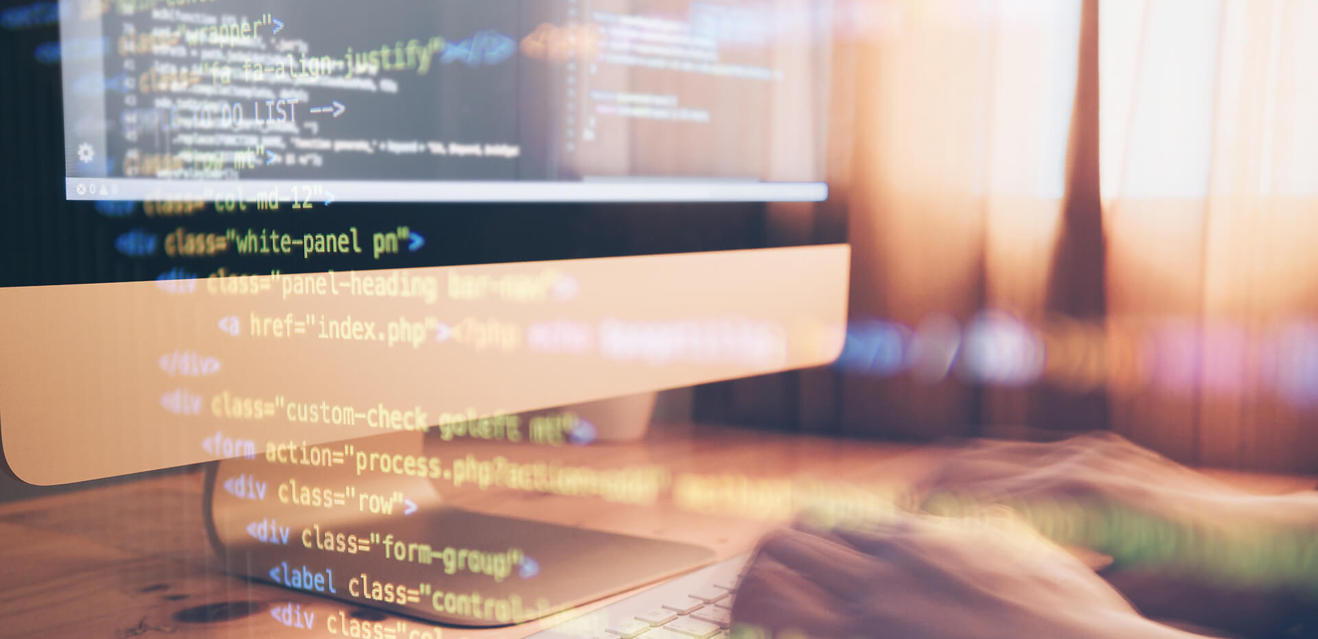 Close-up of computer screen with code and a person typing on keyboard during R Programming and Statistical Analysis training