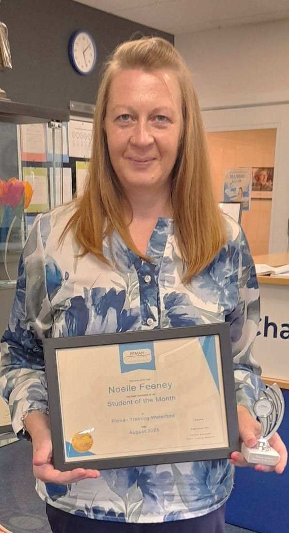 Noelle holding his Student of the Month award certificate at Pitman Training Waterford, August 2025.