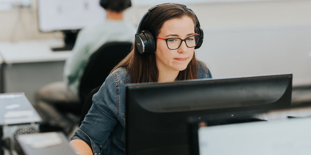 A student building her skills in an IT course, representing the accessible entry routes and growth potential of technology as a career path.