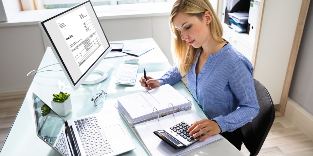 An accountant carefully organizing financial documents, proving that attention to detail is essential to become an accountant without a degree.