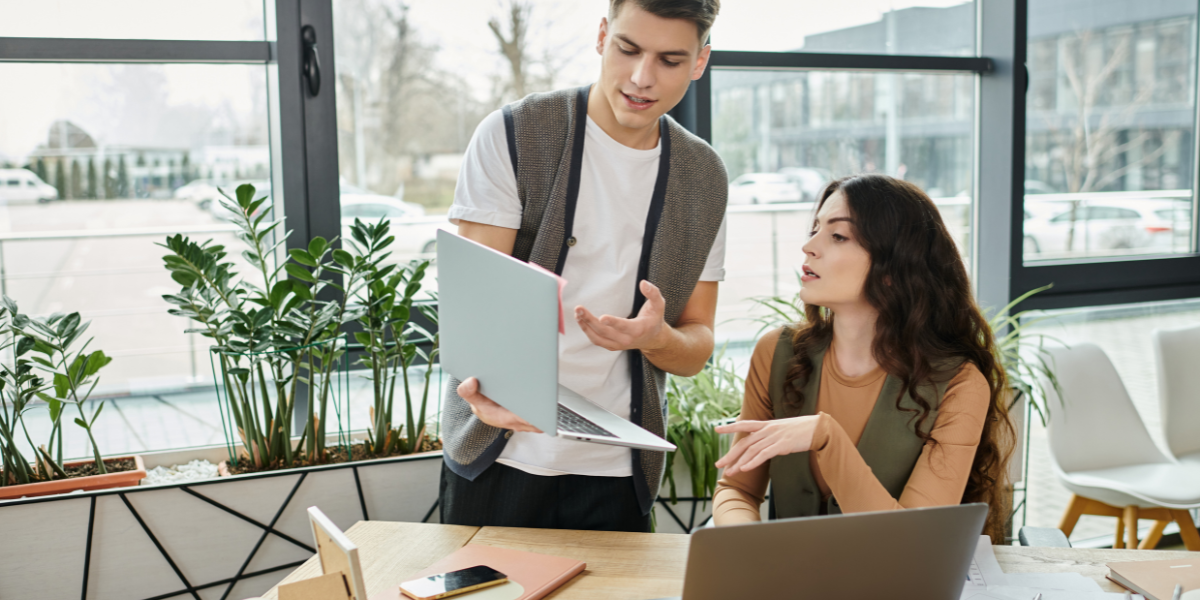 Two Administrative Assistants working together in a modern office setting, showcasing teamwork and efficiency. Start your Office Support or Admin Career in Cork with expert training from Pitman Training.