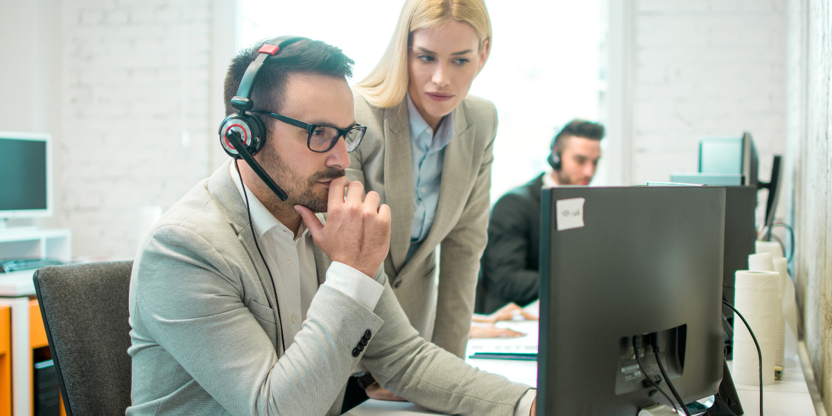 An accounts assistant collaborating with their manager, demonstrating teamwork and career progression opportunities in an Administrative and Accounts career in Kerry.