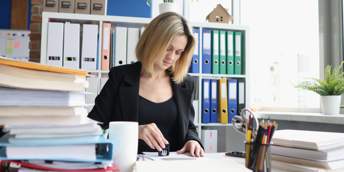 Focused image of a legal secretary in Cork typing legal documents with precision and efficiency, highlighting the importance of strong typing skills and attention to detail in the legal profession.