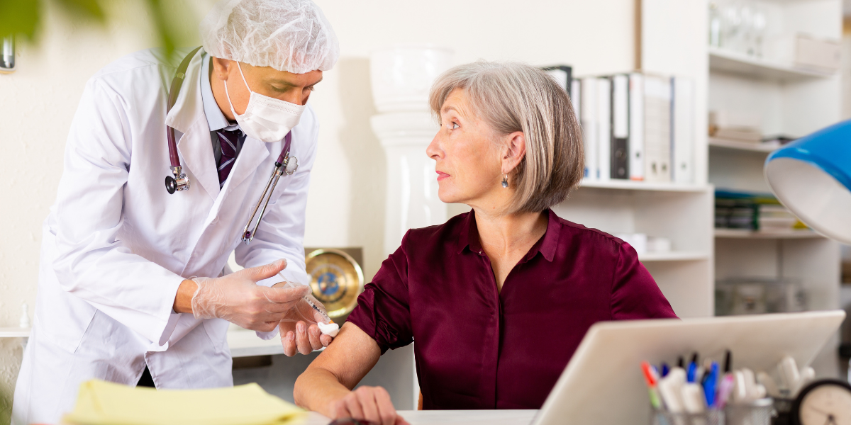 A medical secretary receiving important orders from a doctor, emphasizing the critical role of administrative support in Waterford’s healthcare facilities.