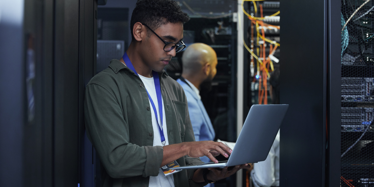 An IT professional checking server performance, demonstrating the essential hardware and network management skills taught in IT career training programs in Wexford.