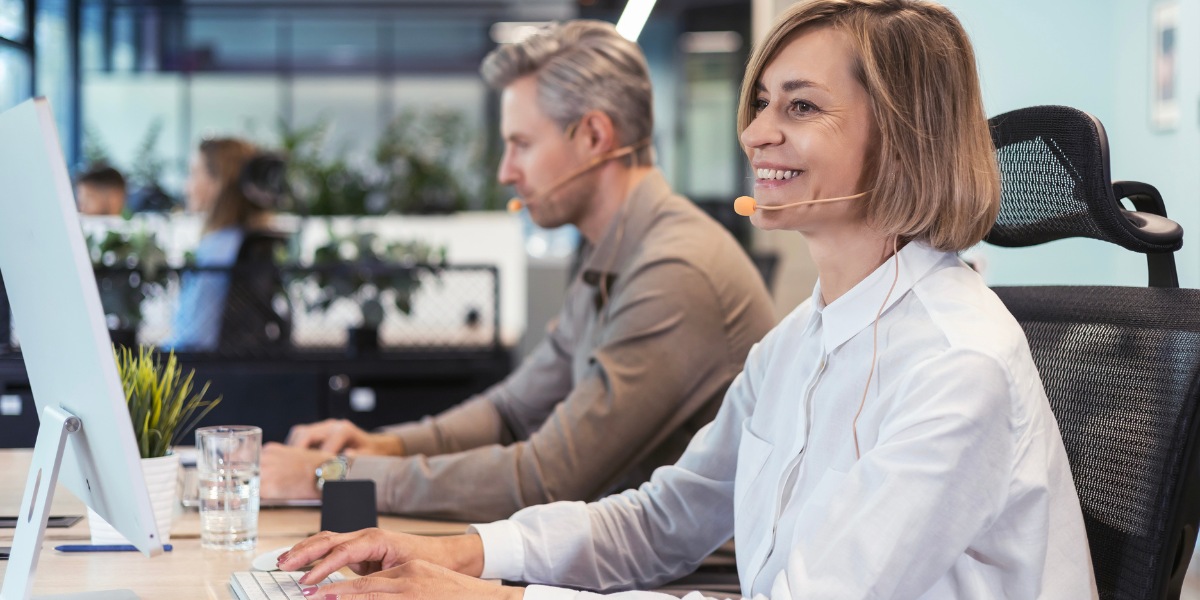 An IT employee assisting a client over the phone, showcasing the customer service and troubleshooting skills emphasized in IT career training in Wexford.