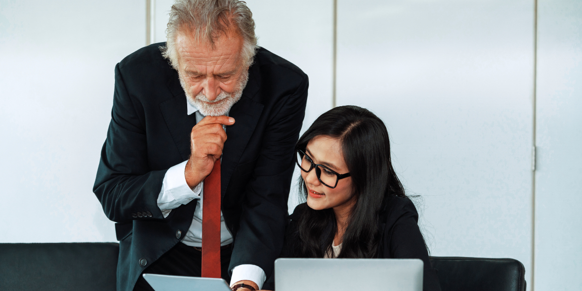 Detailed view of a legal secretary in Cork assisting a lawyer with document preparation, demonstrating the critical administrative and organizational skills required in a legal office.