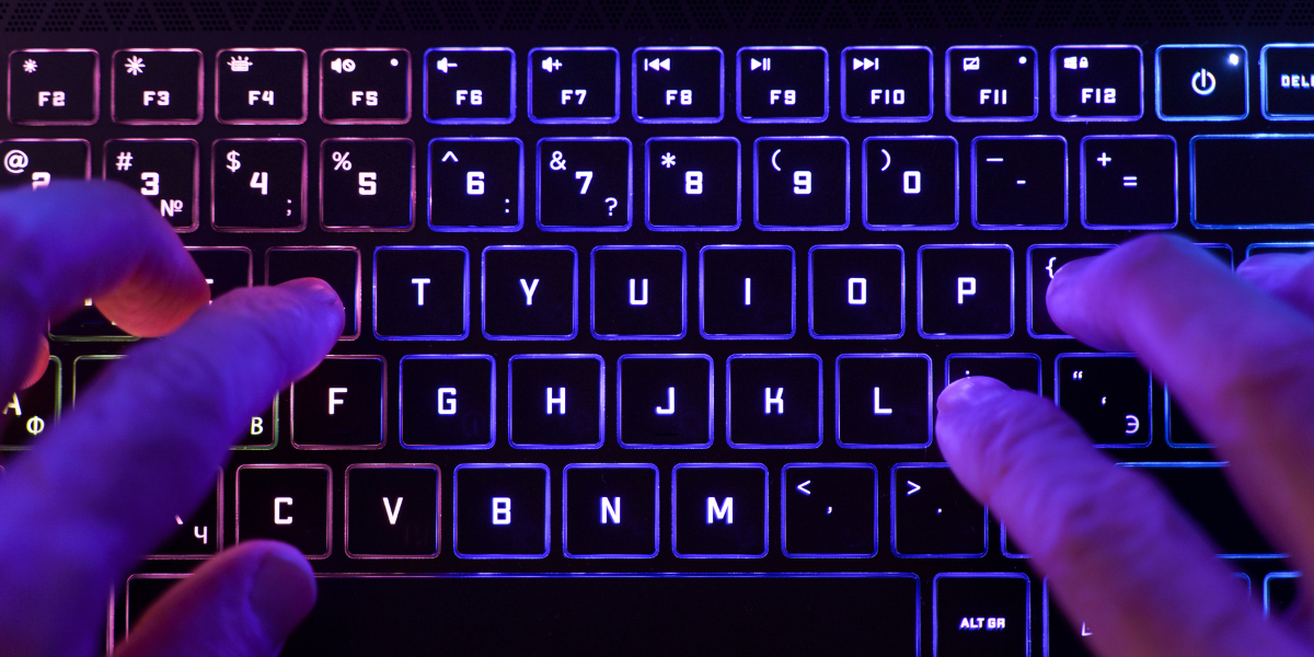 A detailed close-up of a mechanical keyboard featuring eye-catching RGB lighting, offering both aesthetics and performance to improve your workspace setup.