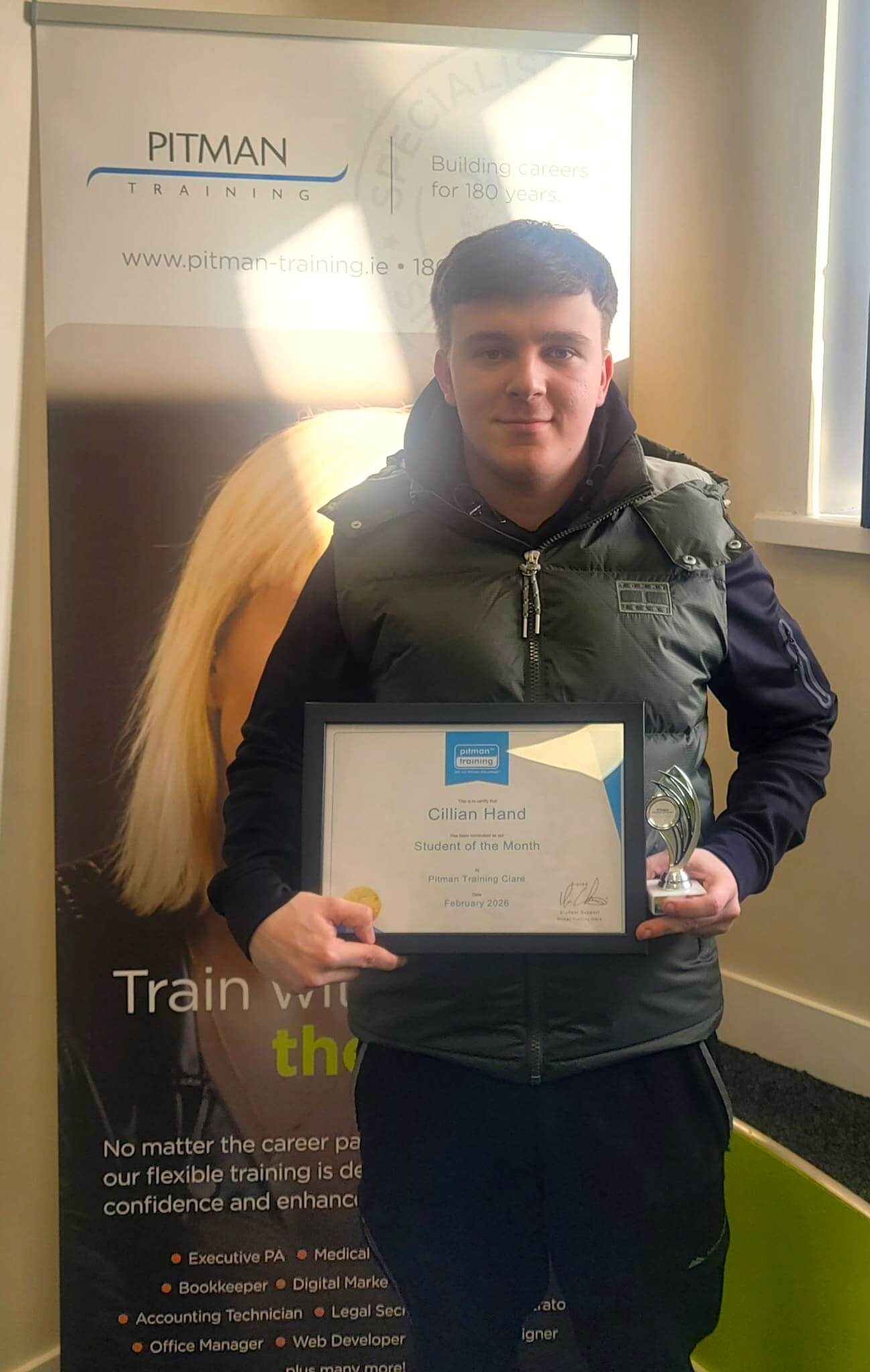 Cillian Hand receiving Student of the Month award at Pitman Training Clare after completing his Start-Up Business Diploma training