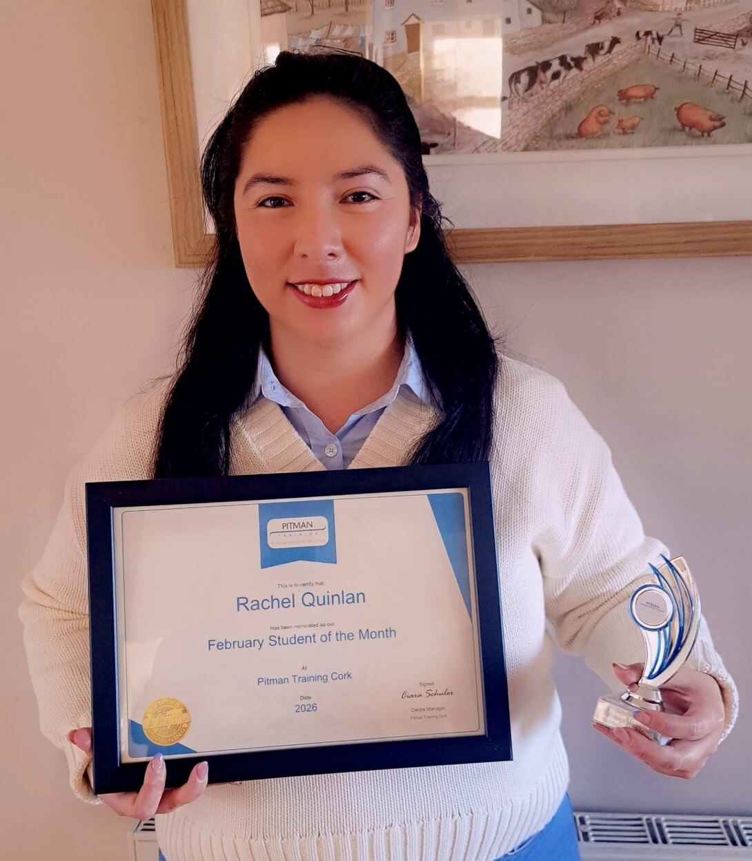 Rachel Quinlan holding Student of the Month certificate and award at Pitman Training Cork