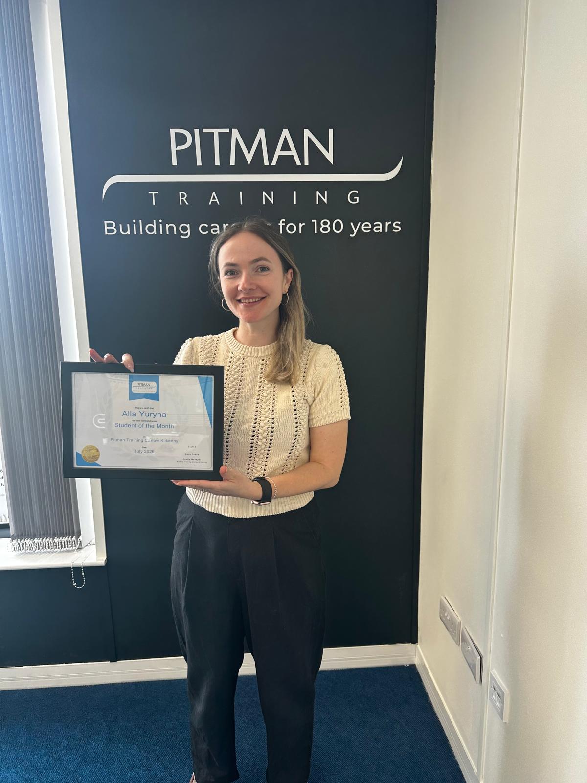 Alla Yuyrna receiving the July 2026 Student of the Month award at Pitman Training Carlow Kilkenny.